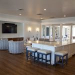 Our secondary event space includes seating, TVs, and a buffet space.